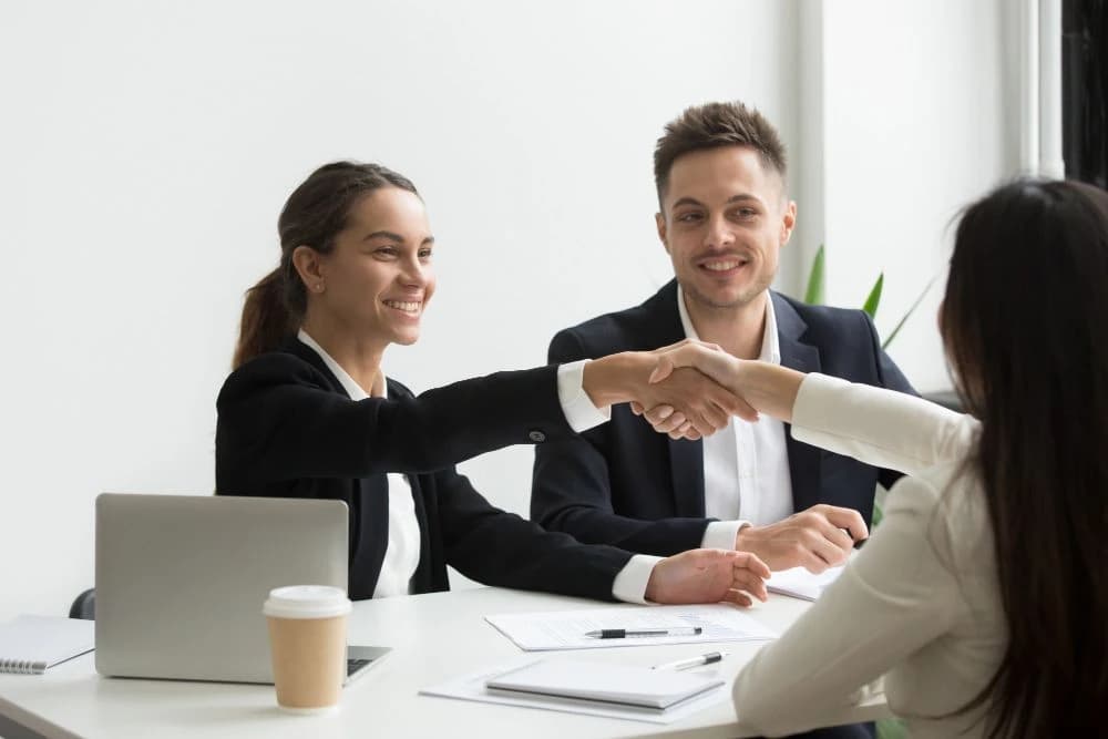 Professional handshake during a successful placement